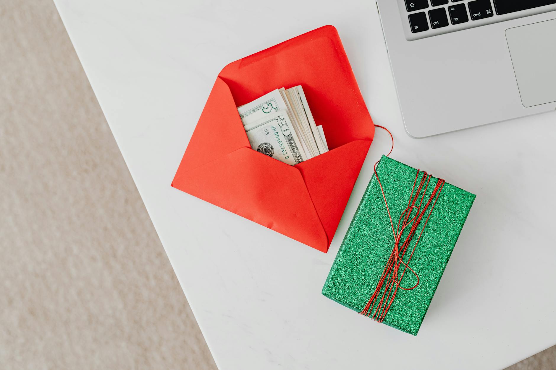 Cash tucked into a holiday envelope for family gift planning.