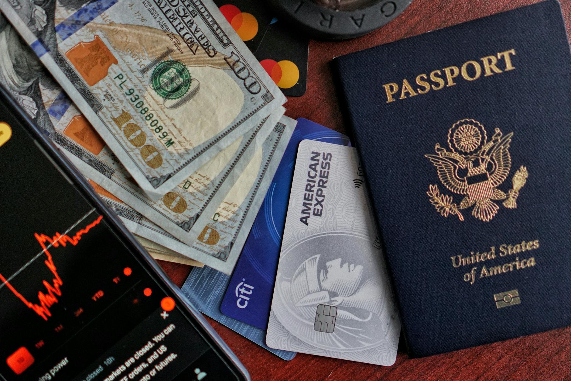 Travel documents, passport, and cash arranged for a year-end credit review.