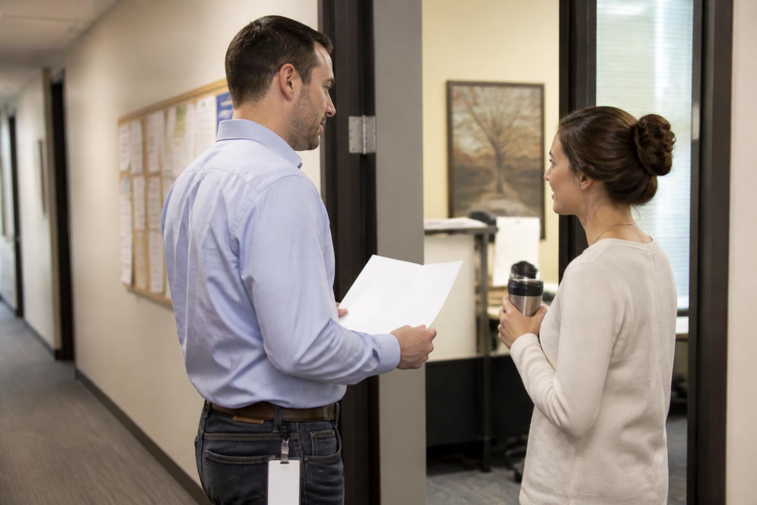 An employee speaking with HR about paycheck withholding.