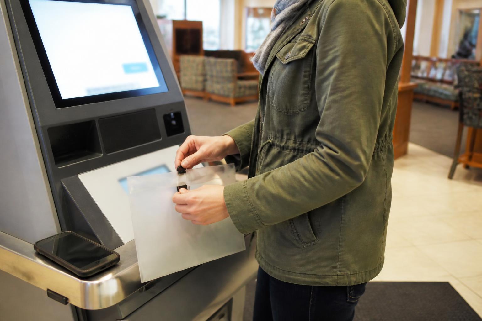 A consumer activating a credit freeze at a privacy kiosk.